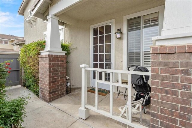 view of exterior entry featuring a porch