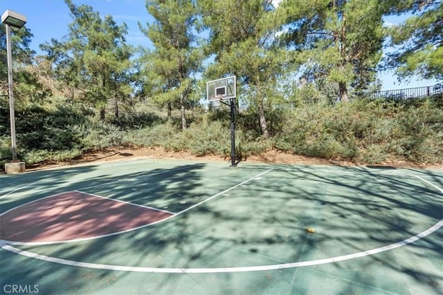 view of sport court featuring community basketball court and fence