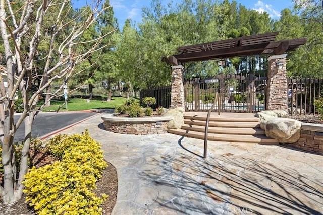 view of property's community featuring fence