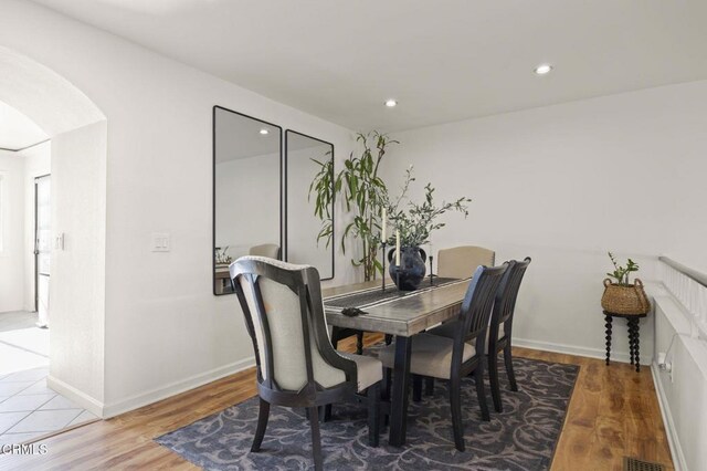 dining area with hardwood / wood-style flooring