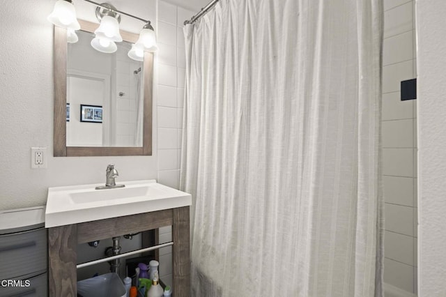 bathroom with vanity and a shower with shower curtain