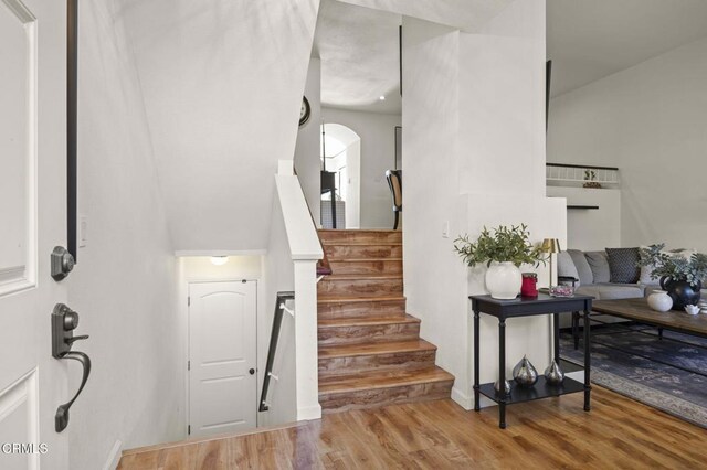 stairs with hardwood / wood-style flooring