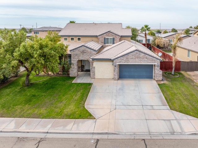 mediterranean / spanish-style house with a garage and a front yard