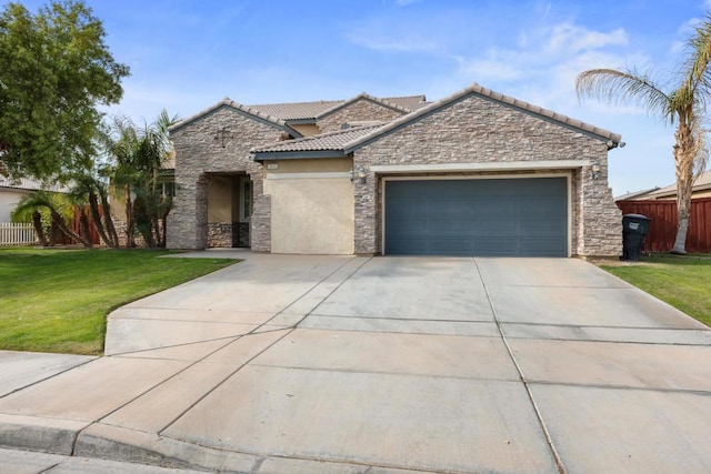 view of front of property with a front yard and a garage