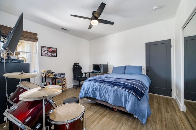 bedroom featuring ceiling fan and light hardwood / wood-style floors