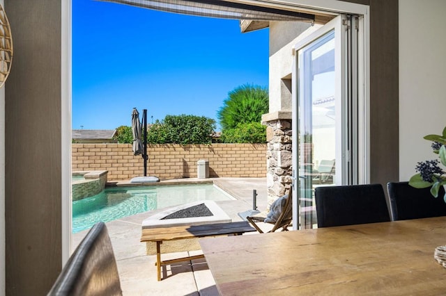 view of swimming pool with a patio