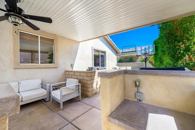 view of patio / terrace featuring ceiling fan