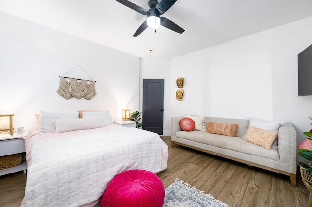 bedroom featuring ceiling fan and hardwood / wood-style floors