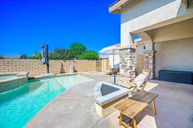 view of pool featuring an in ground hot tub and a patio