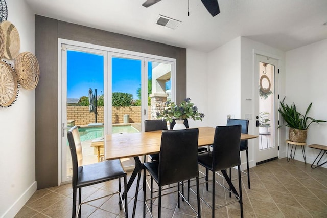 dining room featuring ceiling fan