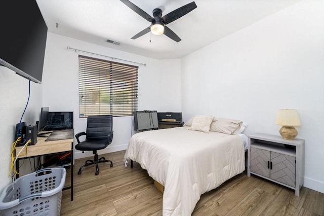 bedroom featuring ceiling fan and light hardwood / wood-style floors