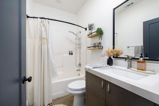 full bathroom with tile patterned flooring, toilet, vanity, and shower / bath combination with curtain