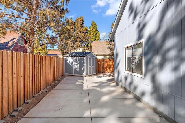 view of patio featuring a storage unit