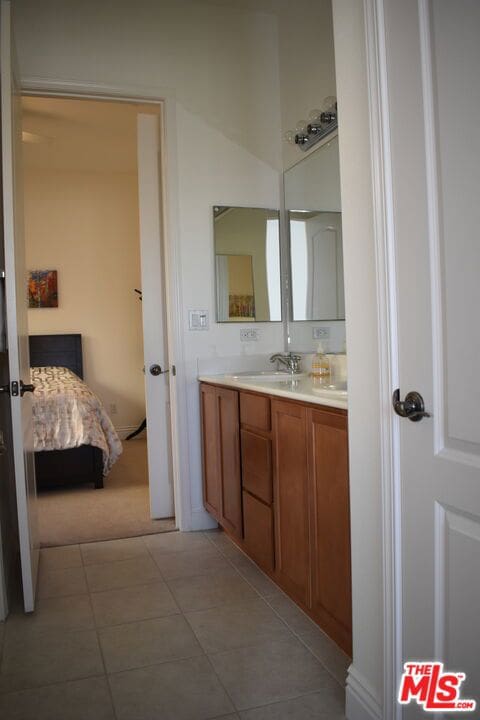 bathroom with vanity and tile patterned floors