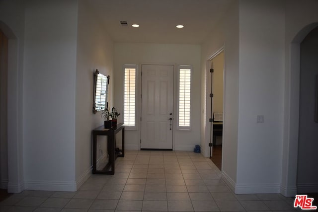 entrance foyer featuring light tile patterned floors