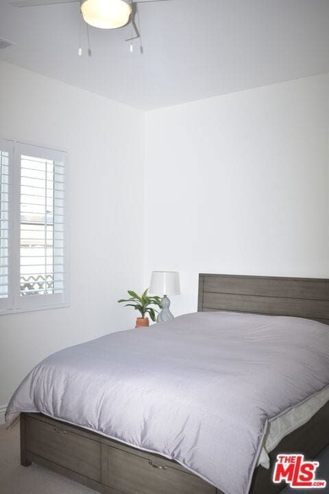 bedroom featuring ceiling fan