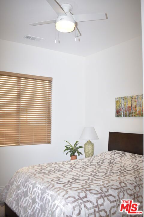 bedroom featuring ceiling fan