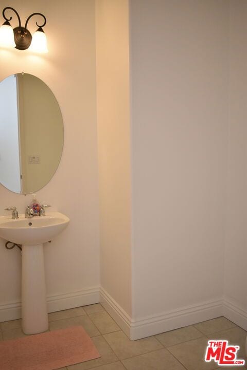 bathroom featuring tile patterned floors and sink