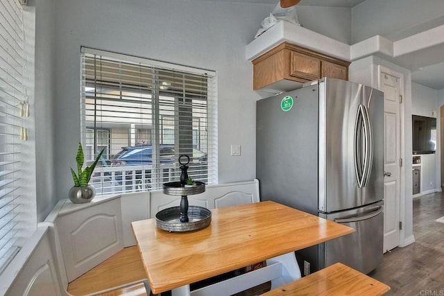 kitchen featuring hardwood / wood-style flooring and stainless steel fridge