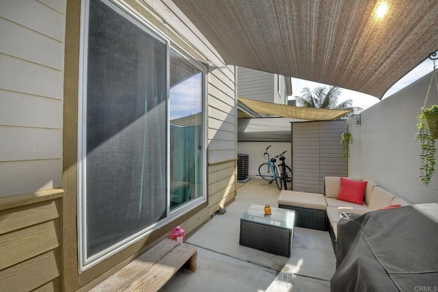 view of patio with an outdoor living space and central AC