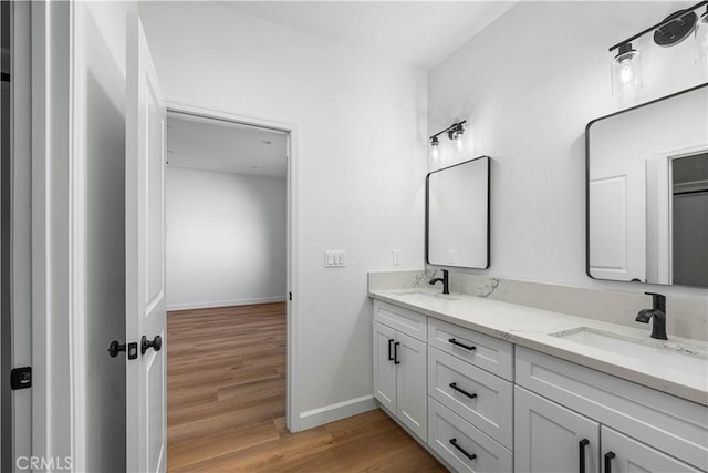 bathroom with vanity and hardwood / wood-style flooring