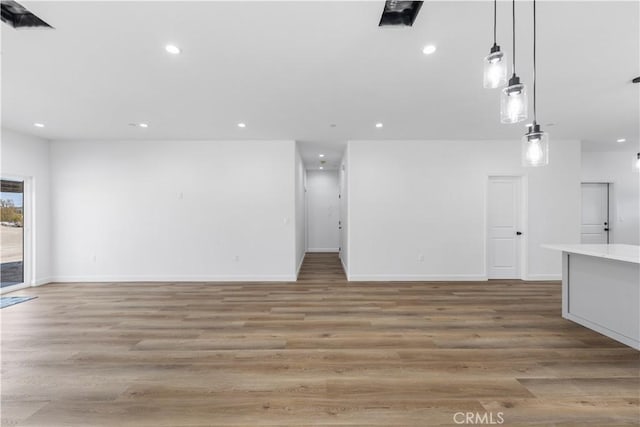 unfurnished living room with light hardwood / wood-style flooring