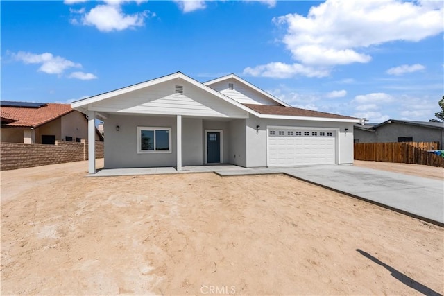 ranch-style home featuring a garage