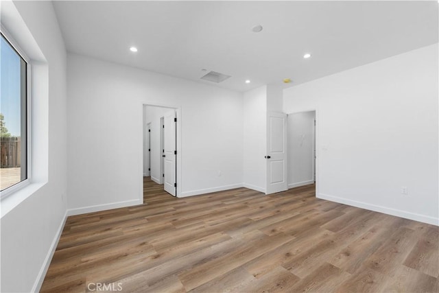 spare room with light hardwood / wood-style floors