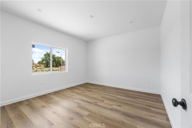 empty room featuring hardwood / wood-style floors