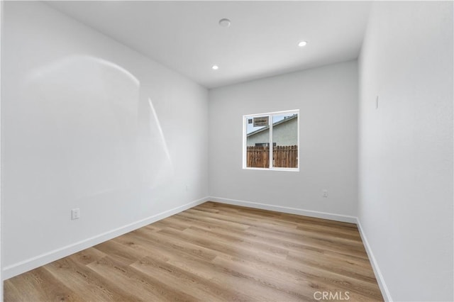 empty room with light hardwood / wood-style floors