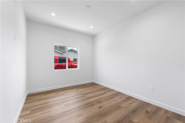 unfurnished room with light hardwood / wood-style floors