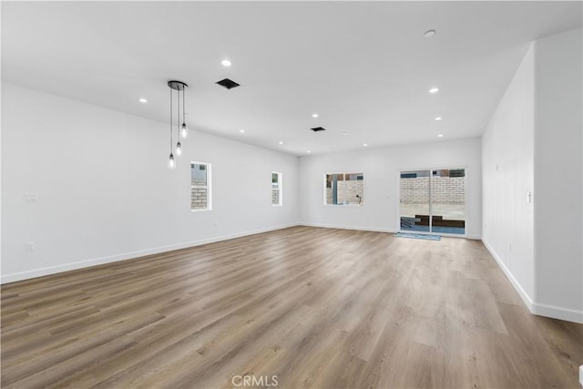 unfurnished living room featuring light wood-type flooring