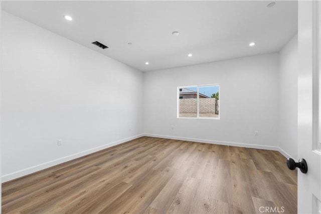 unfurnished room featuring light hardwood / wood-style flooring