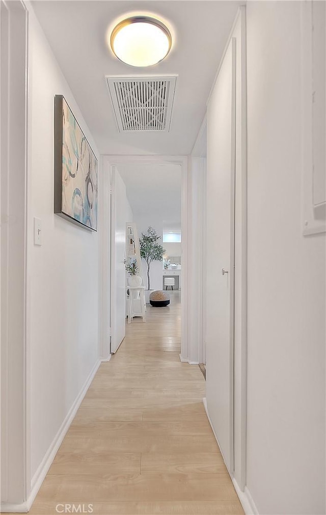 corridor featuring light wood-type flooring