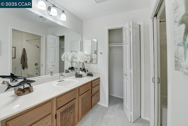 bathroom with vanity and walk in shower