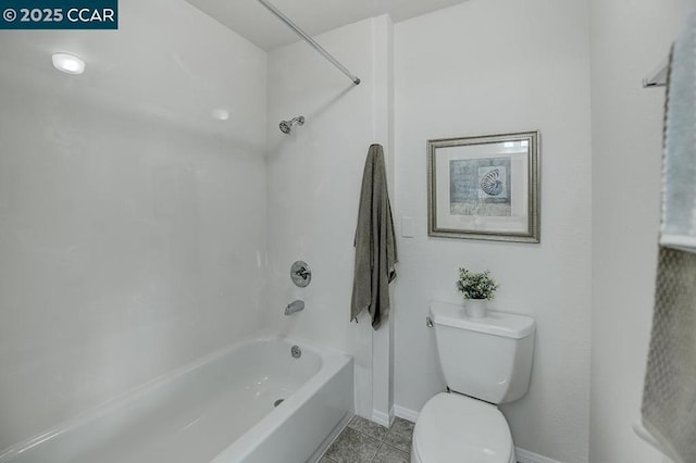 bathroom featuring shower / tub combination, toilet, and tile patterned floors