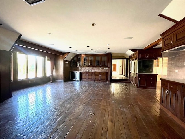 unfurnished living room featuring dark hardwood / wood-style floors