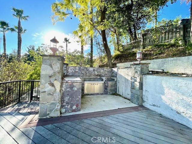 wooden deck with area for grilling