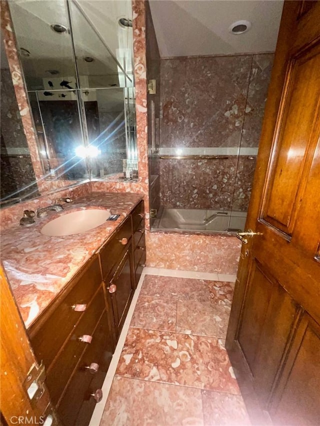 bathroom with vanity and  shower combination