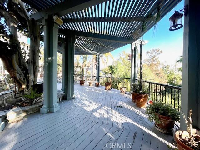 wooden terrace featuring a pergola