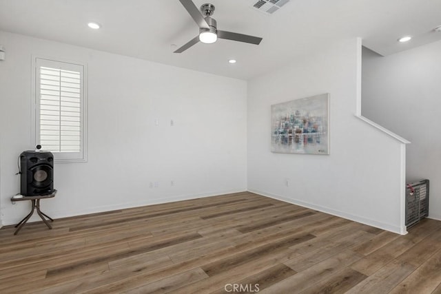 empty room with recessed lighting, visible vents, and wood finished floors