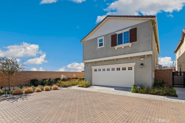 view of front of property featuring a garage