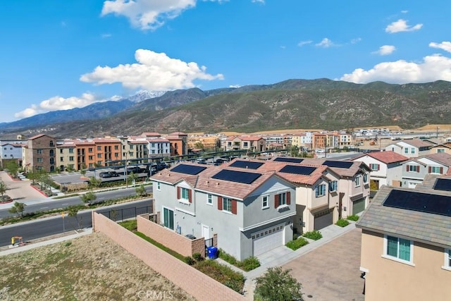 drone / aerial view featuring a residential view and a mountain view