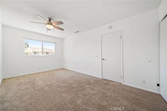 carpeted empty room with ceiling fan