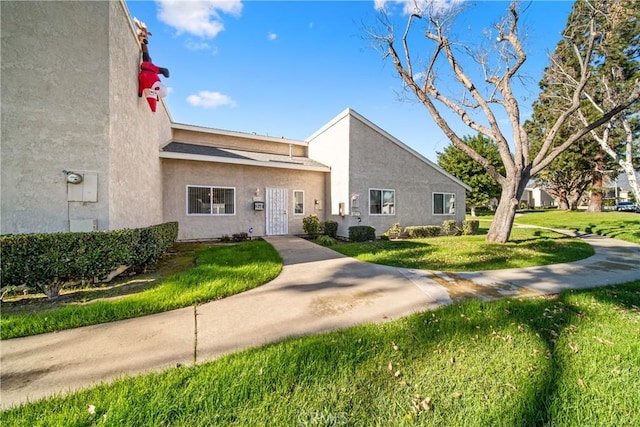 exterior space featuring central AC and a front yard