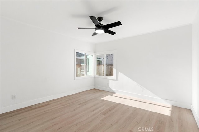 empty room with light hardwood / wood-style floors and ceiling fan