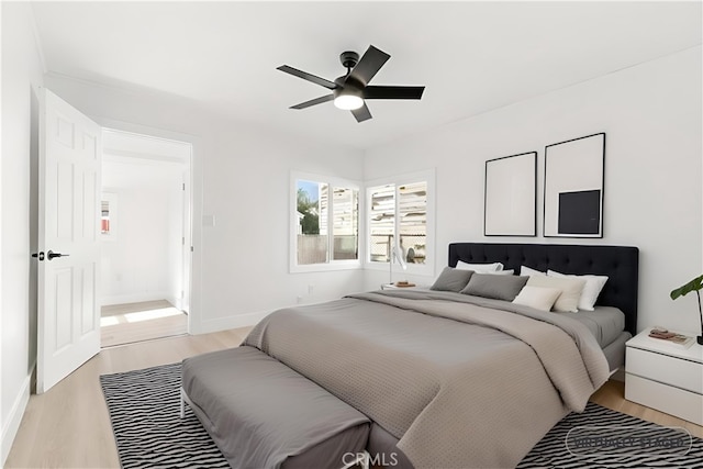 bedroom featuring ceiling fan and light hardwood / wood-style flooring