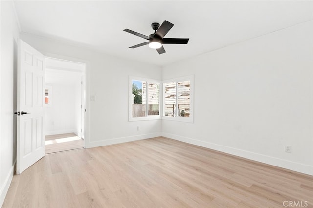 empty room featuring light hardwood / wood-style floors and ceiling fan