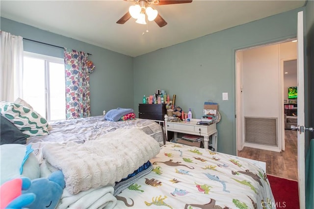 bedroom featuring ceiling fan and wood-type flooring