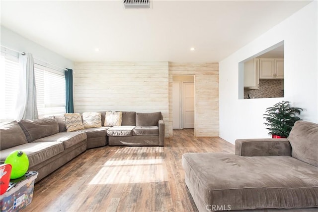 living room with light hardwood / wood-style flooring